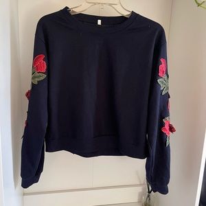 Navy cropped sweater with flower appliqués
